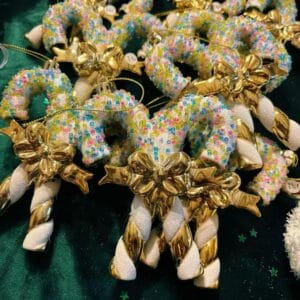 temp_image_208aae92-a7e1-4e74-babd-abbc23bca4b6 Sucette à suspendre - gamme dorée